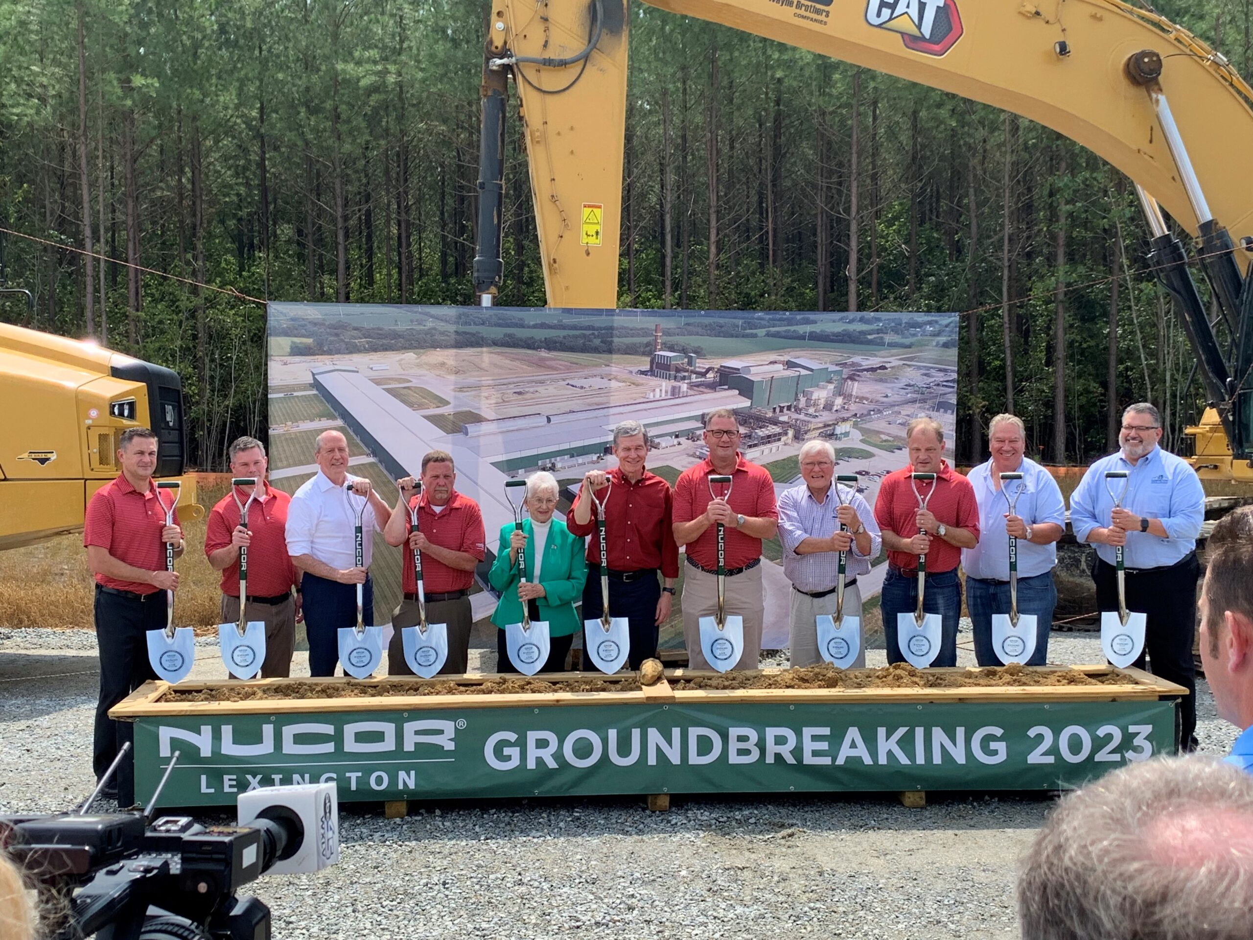 NUCOR of Lexington's ground breaking ceremony. Lexington leaders and NUCOR leaders pose with shovels for the ceremony.